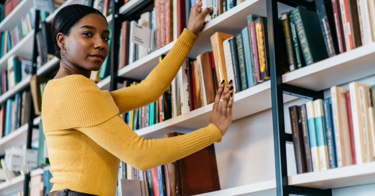 A young woman shelves books